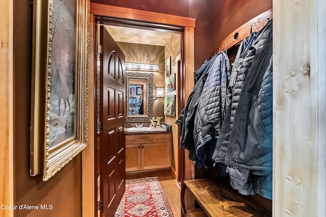 mudroom featuring light hardwood / wood-style floors and sink