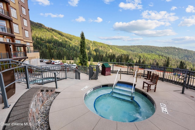 view of pool featuring a hot tub