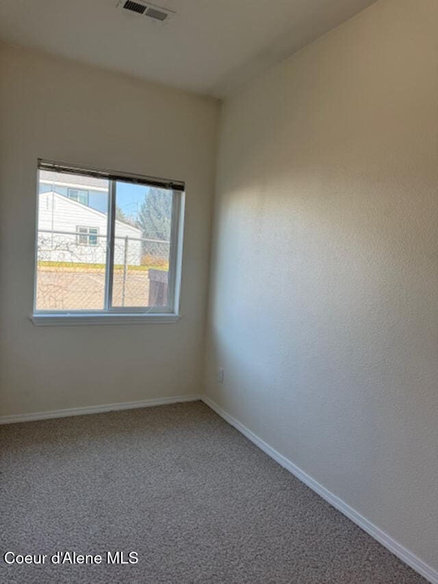 view of carpeted spare room