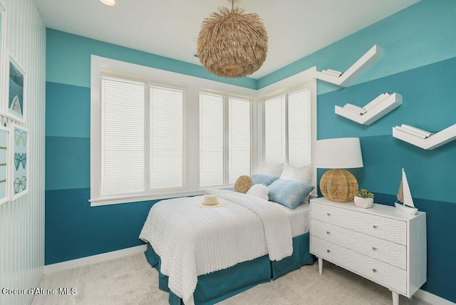 bedroom featuring light colored carpet