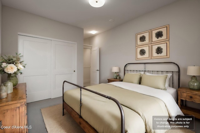 bedroom featuring a closet and finished concrete flooring