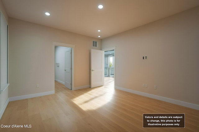 empty room featuring recessed lighting, visible vents, baseboards, and light wood-style floors