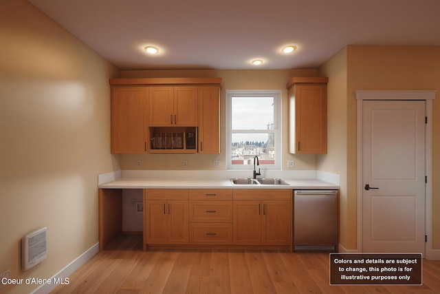 kitchen with light wood-style flooring, a sink, stainless steel dishwasher, light countertops, and baseboards