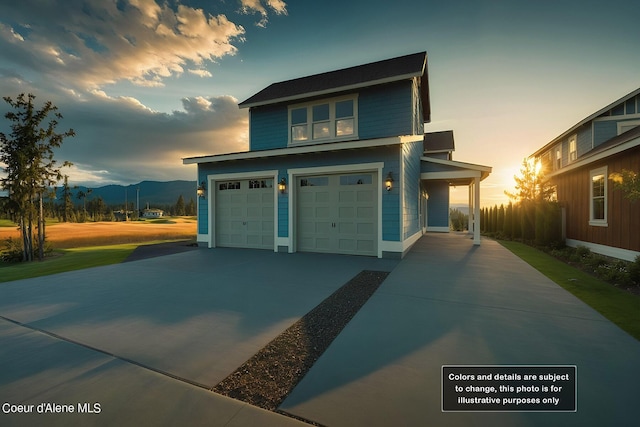 view of front of house featuring concrete driveway and a garage