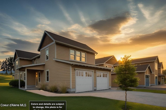 view of front of house featuring a front lawn, an attached garage, and driveway