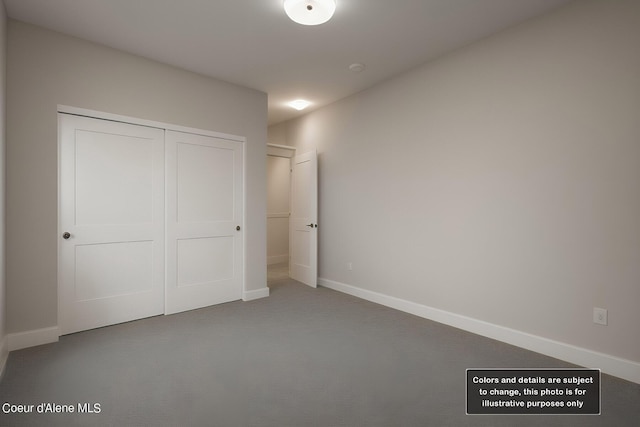 unfurnished bedroom with a closet and baseboards