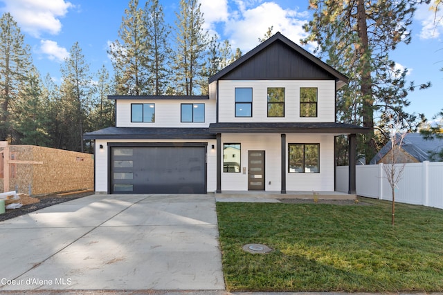 view of front facade with a garage and a front lawn