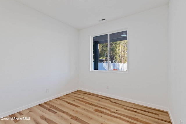 unfurnished room with light hardwood / wood-style flooring