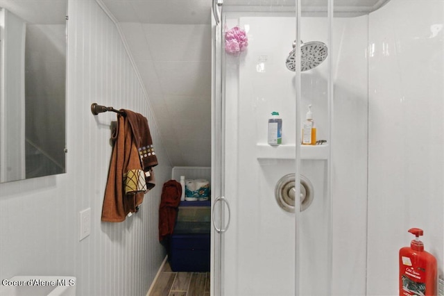 bathroom featuring wood-type flooring and walk in shower