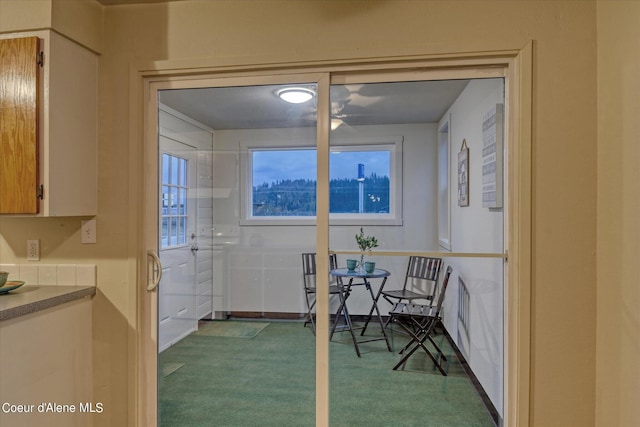 interior space featuring light colored carpet