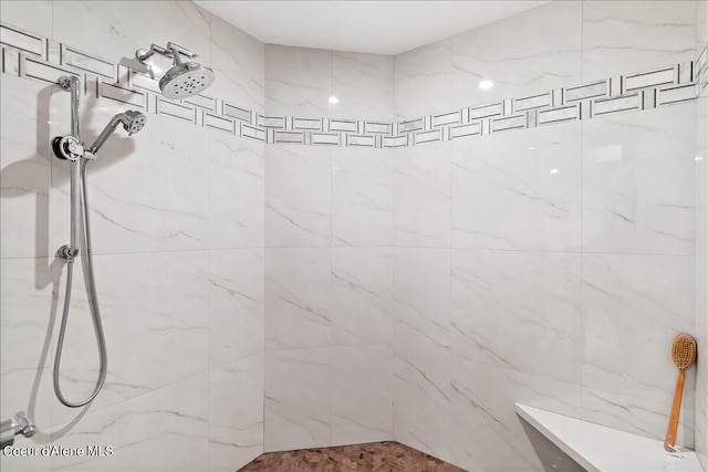 bathroom with tiled shower