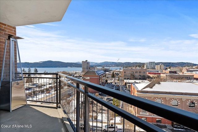 balcony with a water and mountain view