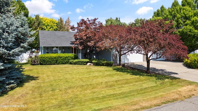 view of front of house featuring a garage and a front yard