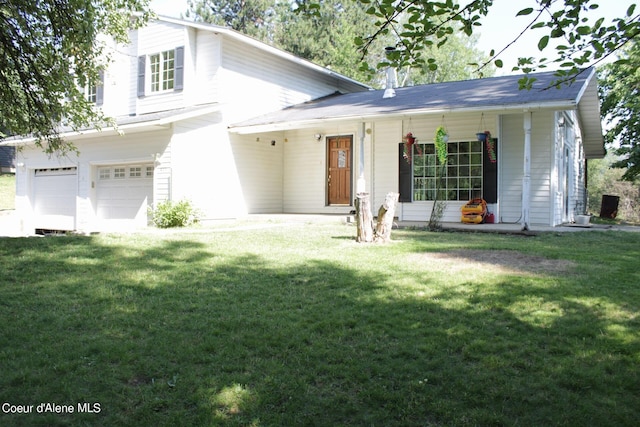 view of front facade featuring a garage and a front lawn