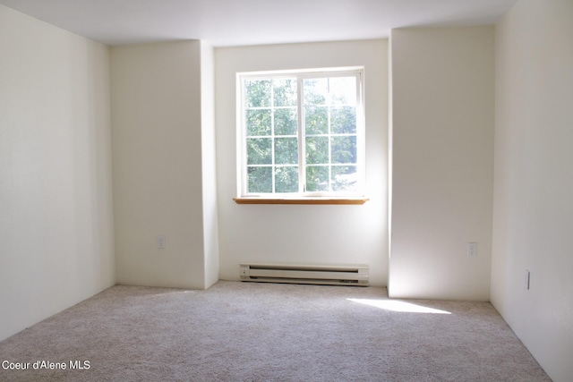 unfurnished room with a baseboard radiator and carpet flooring