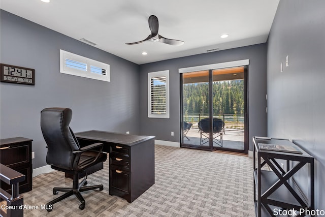 office space with recessed lighting, visible vents, a ceiling fan, light carpet, and baseboards