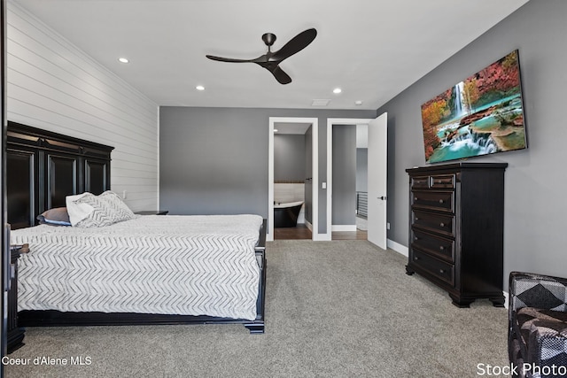 bedroom with carpet, ensuite bathroom, baseboards, and recessed lighting