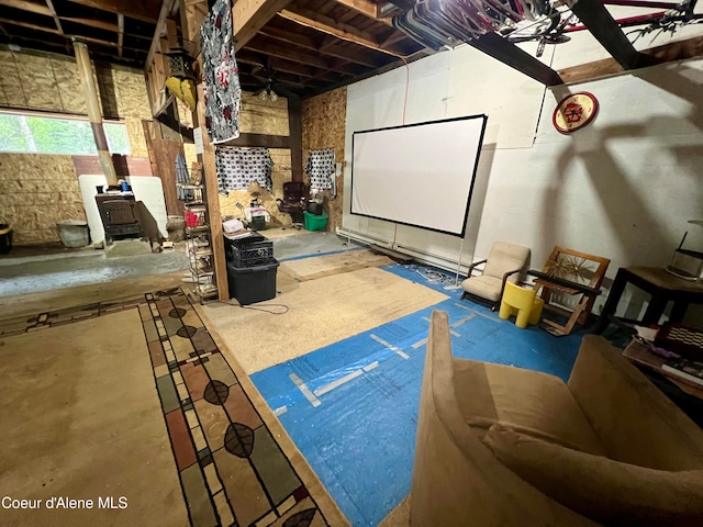 home theater room featuring concrete flooring