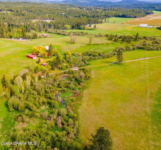 birds eye view of property featuring a rural view