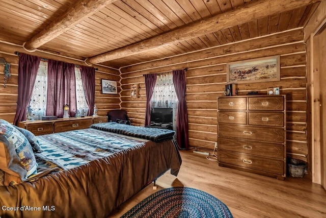bedroom with wood ceiling, beam ceiling, rustic walls, and light wood-type flooring