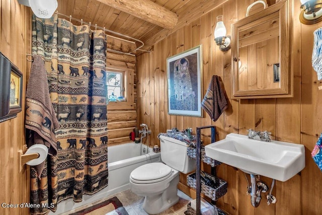 bathroom featuring beamed ceiling, log walls, toilet, shower / tub combo with curtain, and wooden ceiling