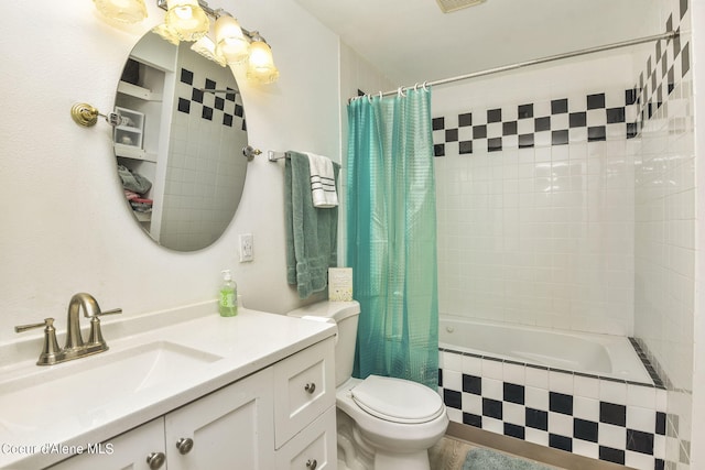 full bath with visible vents, tiled shower / bath, toilet, and vanity