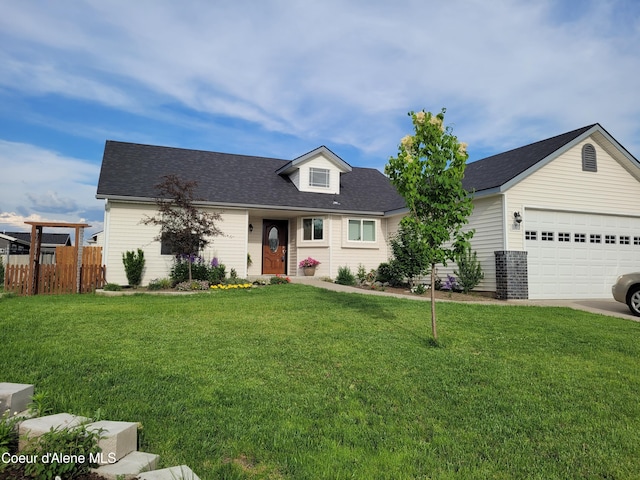 view of front facade with a front lawn, an attached garage, fence, and brick siding