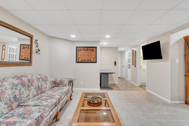 living area with recessed lighting, baseboards, a drop ceiling, and light colored carpet