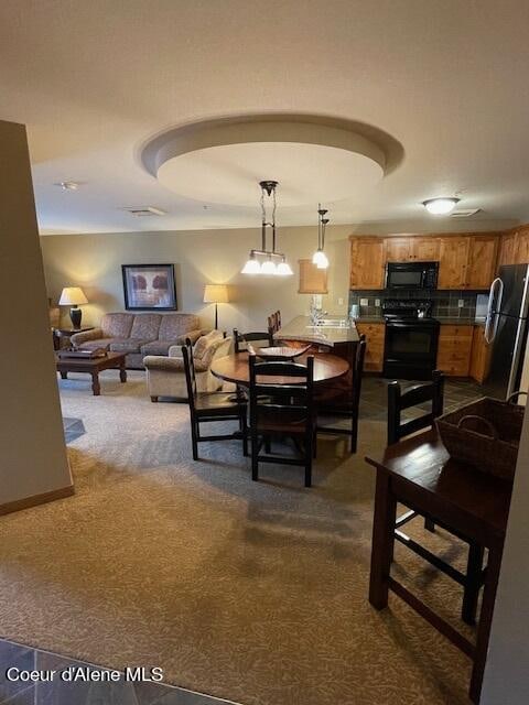 dining area featuring carpet floors