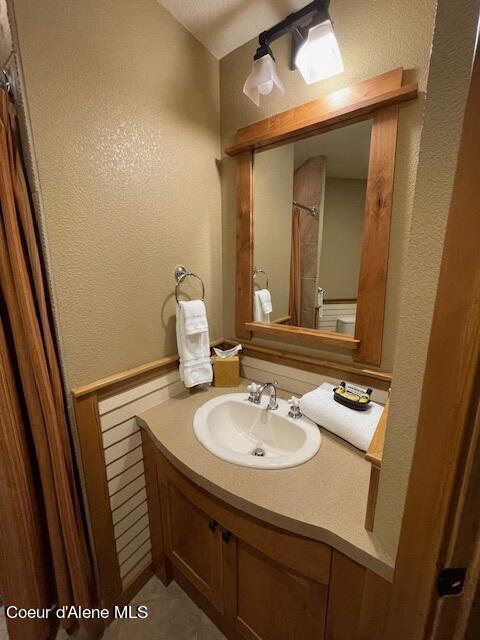 110 Morning Star Dr Unit 237, Kellogg, ID 83837 - bathroom featuring vanity and a textured wall