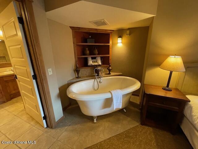 110 Morning Star Dr Unit 237, Kellogg, ID 83837 - full bathroom featuring baseboards, tile patterned flooring, a freestanding bath, and visible vents