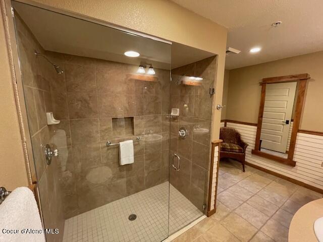 110 Morning Star Dr Unit 237, Kellogg, ID 83837 - bathroom featuring recessed lighting, a shower stall, and tile patterned flooring
