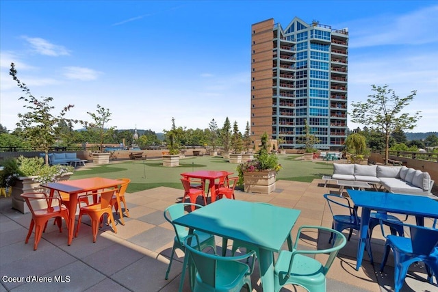 view of patio with an outdoor hangout area and outdoor dining area