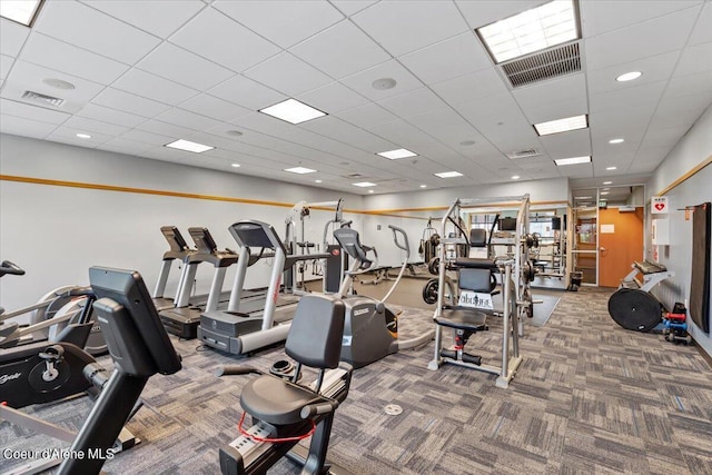 gym featuring carpet, visible vents, and a drop ceiling