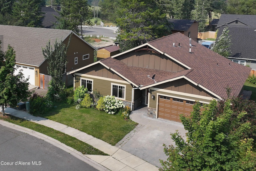 822 Northview Dr, Sandpoint, ID 83864 - view of front of house with a garage and a front yard