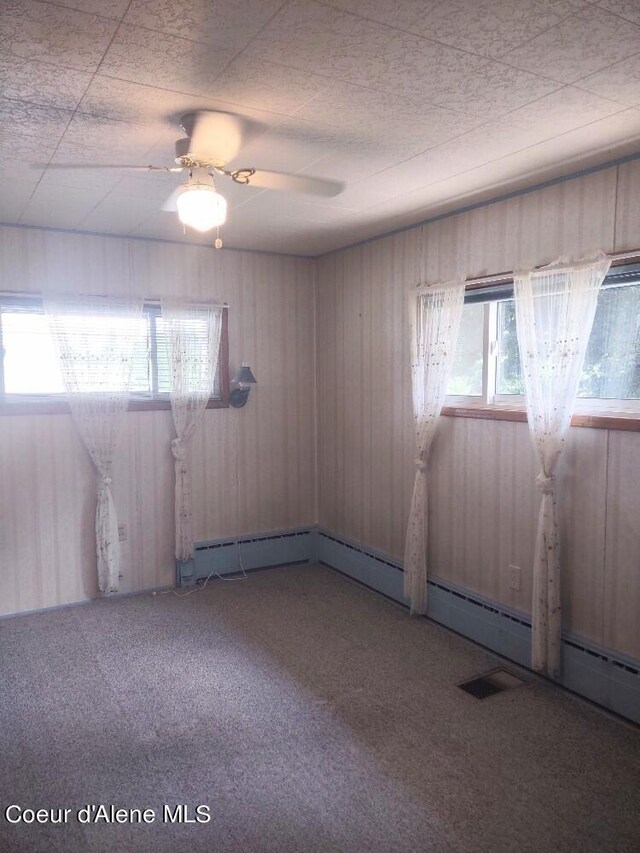 empty room with carpet and ceiling fan