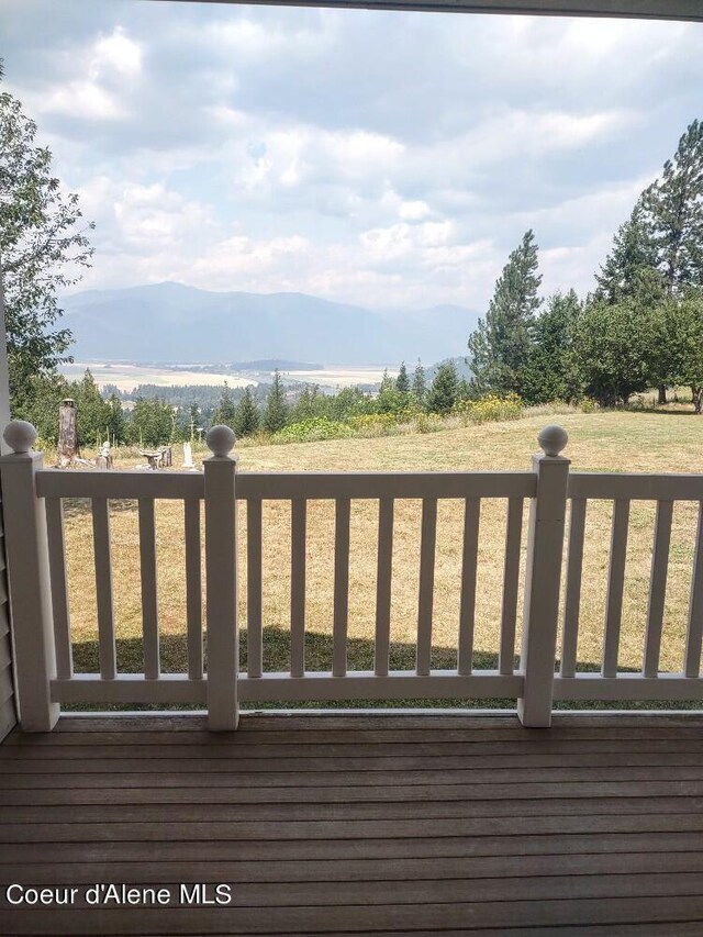 wooden terrace featuring a mountain view