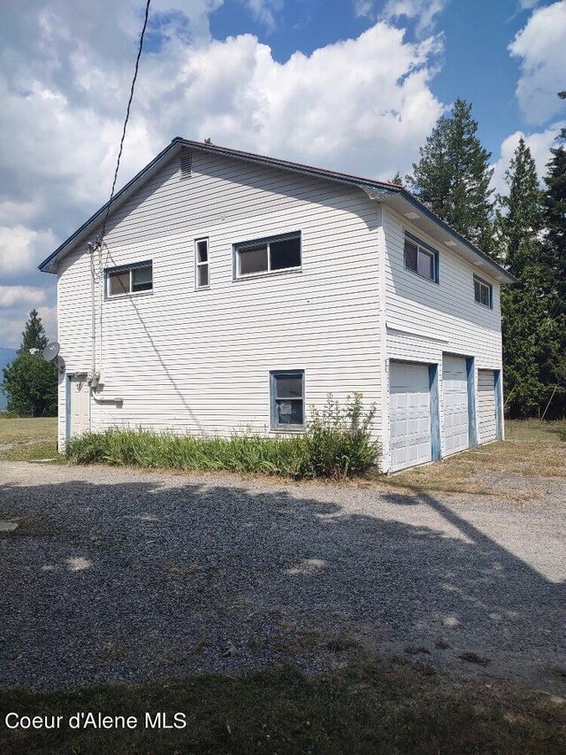 view of side of home with a garage