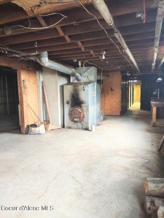 basement featuring heating unit