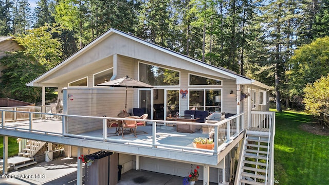 rear view of house featuring a deck