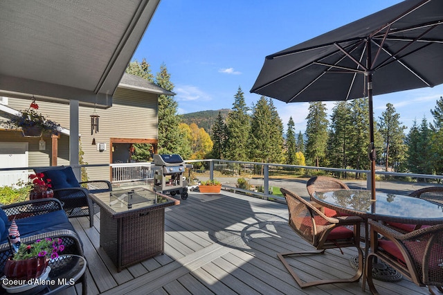 wooden deck featuring grilling area