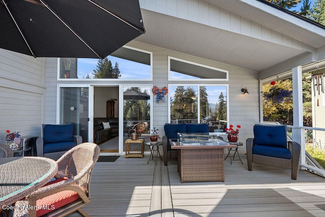 deck featuring outdoor lounge area