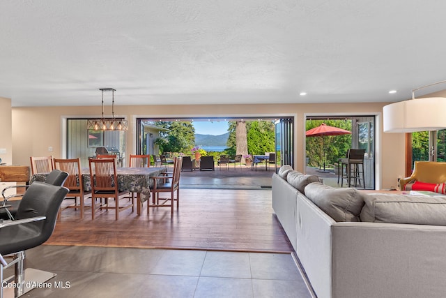 living room with hardwood / wood-style floors and a chandelier