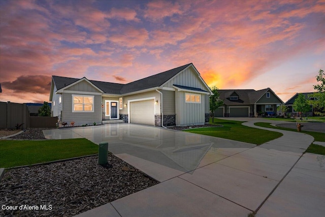 view of front facade featuring a garage and a yard