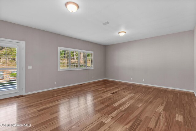 empty room featuring hardwood / wood-style flooring