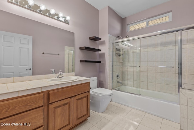 full bathroom with tile patterned flooring, enclosed tub / shower combo, vanity, and toilet