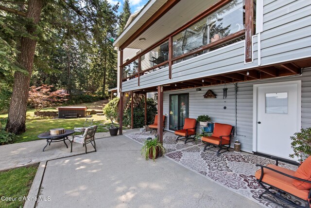 view of patio with a fire pit