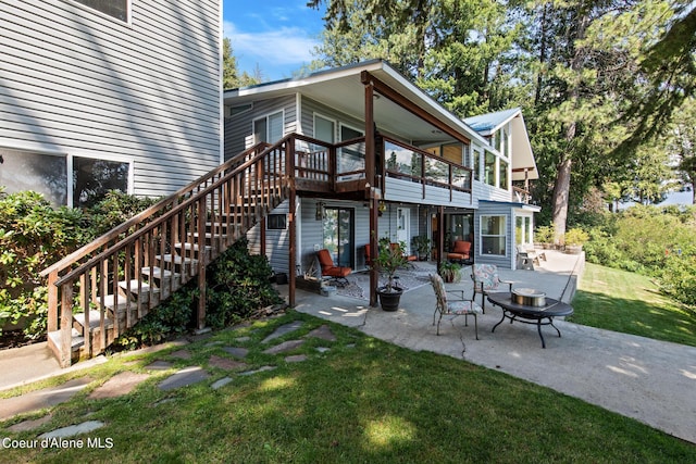 back of house with a patio, stairway, and a yard