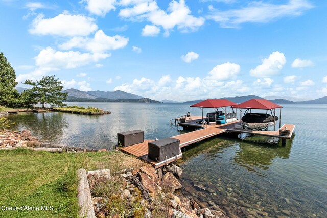 dock area with a water and mountain view