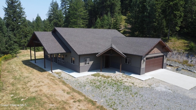 view of front of property featuring a garage and a front lawn